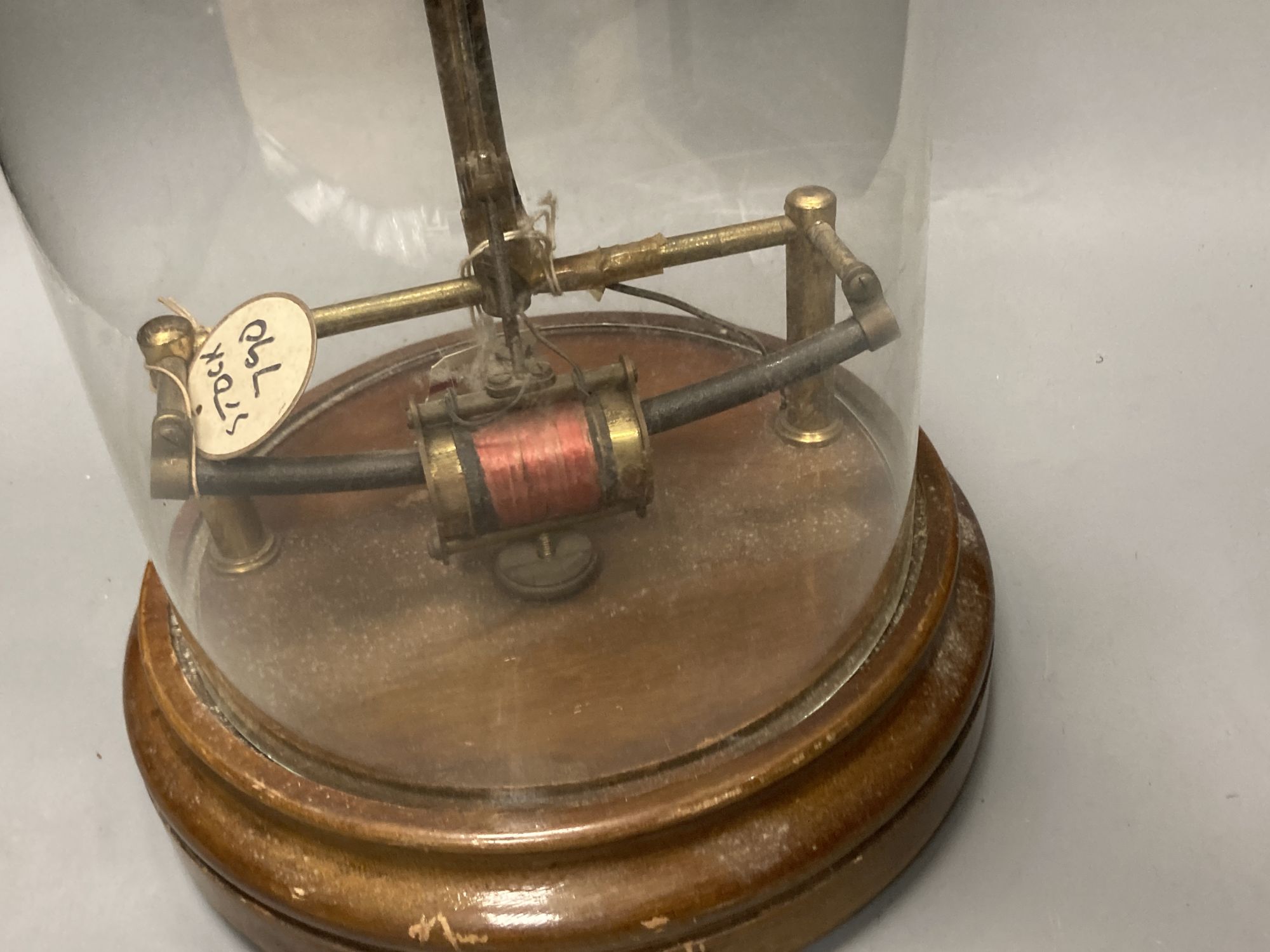 A Bulle skeleton electric mantel clock, under a glass dome, height 38cm